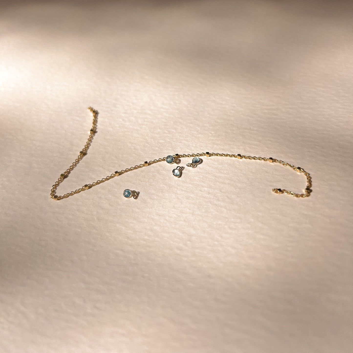 Swiss Blue Topaz Charm Natural Round Bezel Set in 14k Yellow Gold