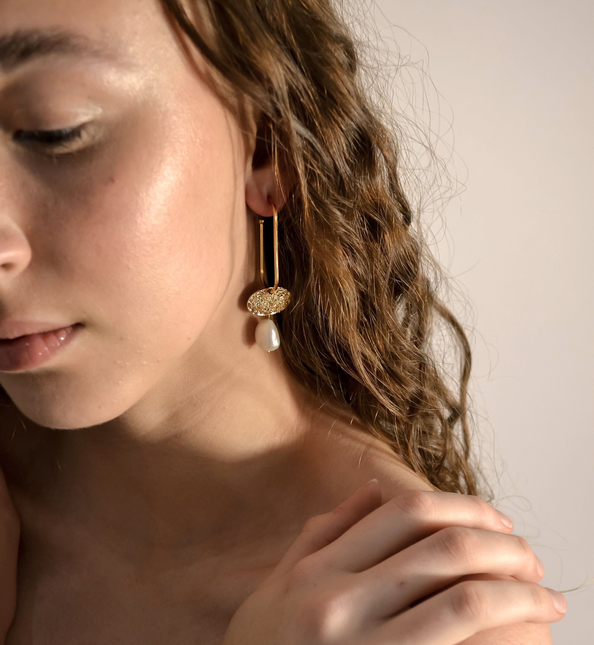 Model wearing wedding pearl drop earrings, gold handmade