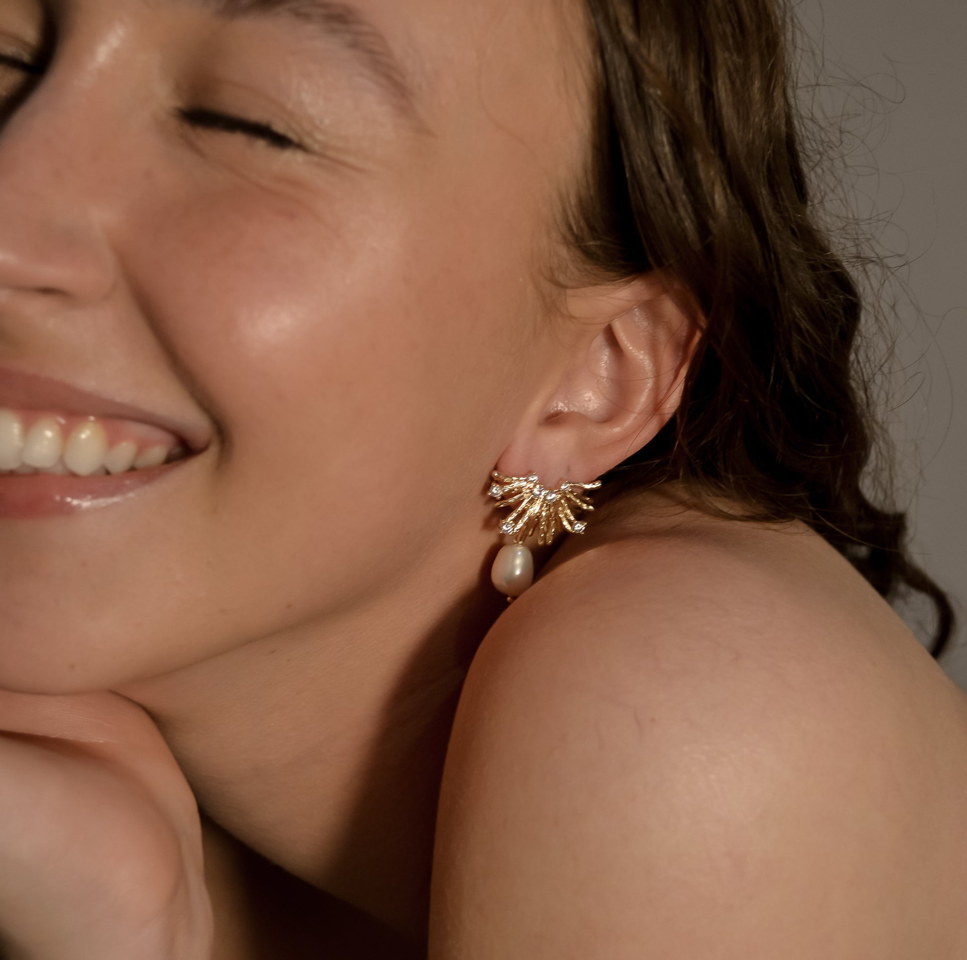 model wearing Charlotte collection, pearl drop earring gold