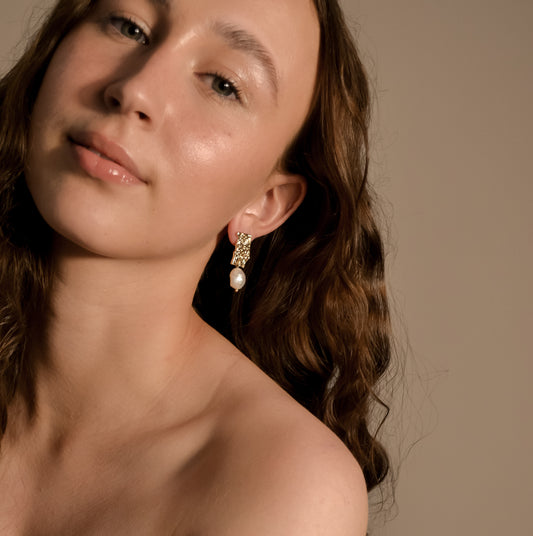 model wearing Genevieve collection, single large pearl, drop stud on gold pressed earring, unique stylish handmade s