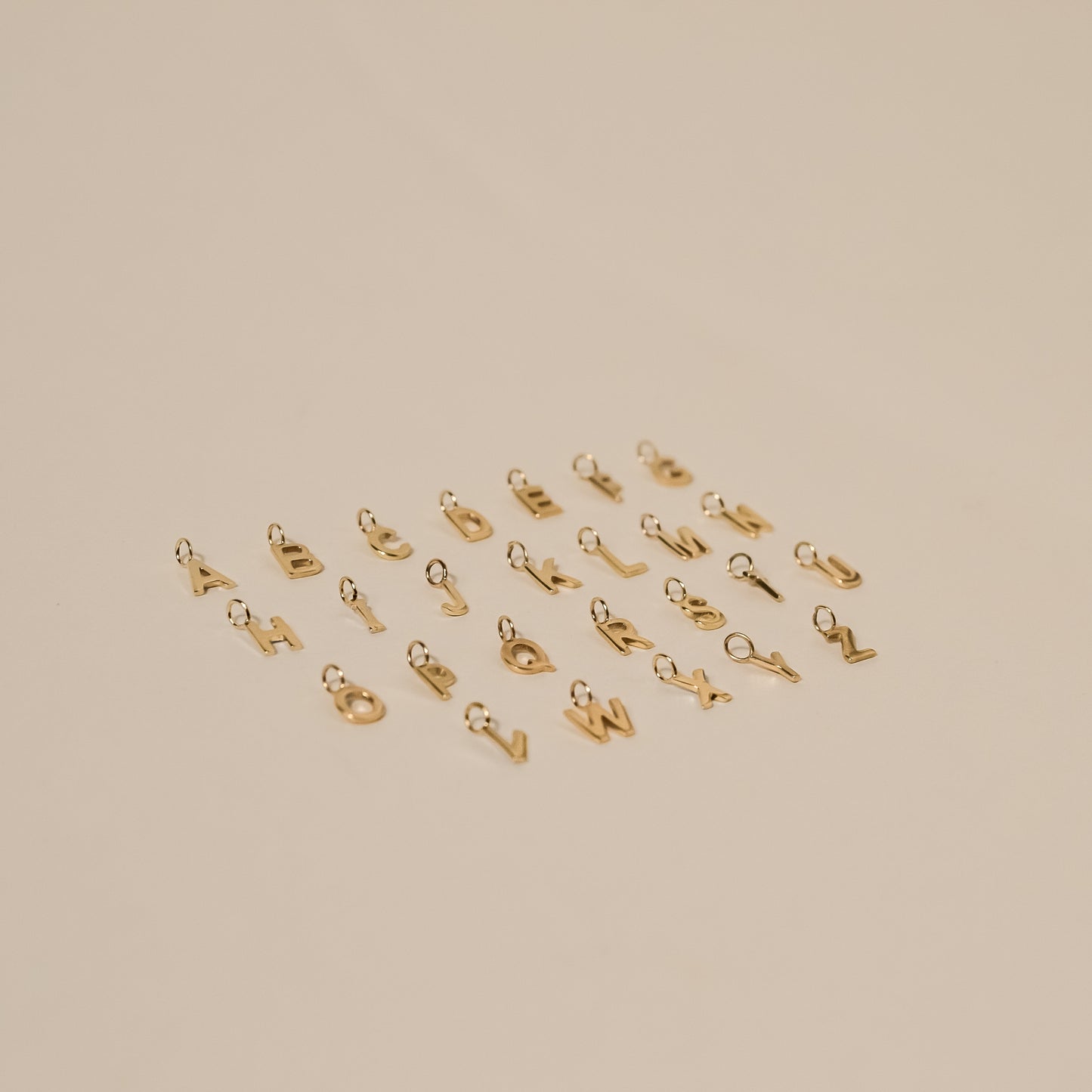 initial charm yello gold tiny letter