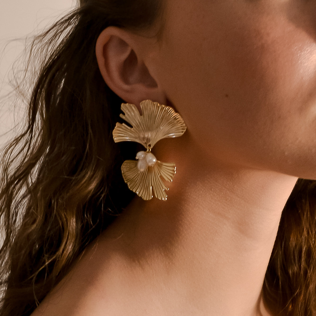 Model wearing Melody collection, bold modern gold bridal with cluster pearl earrings