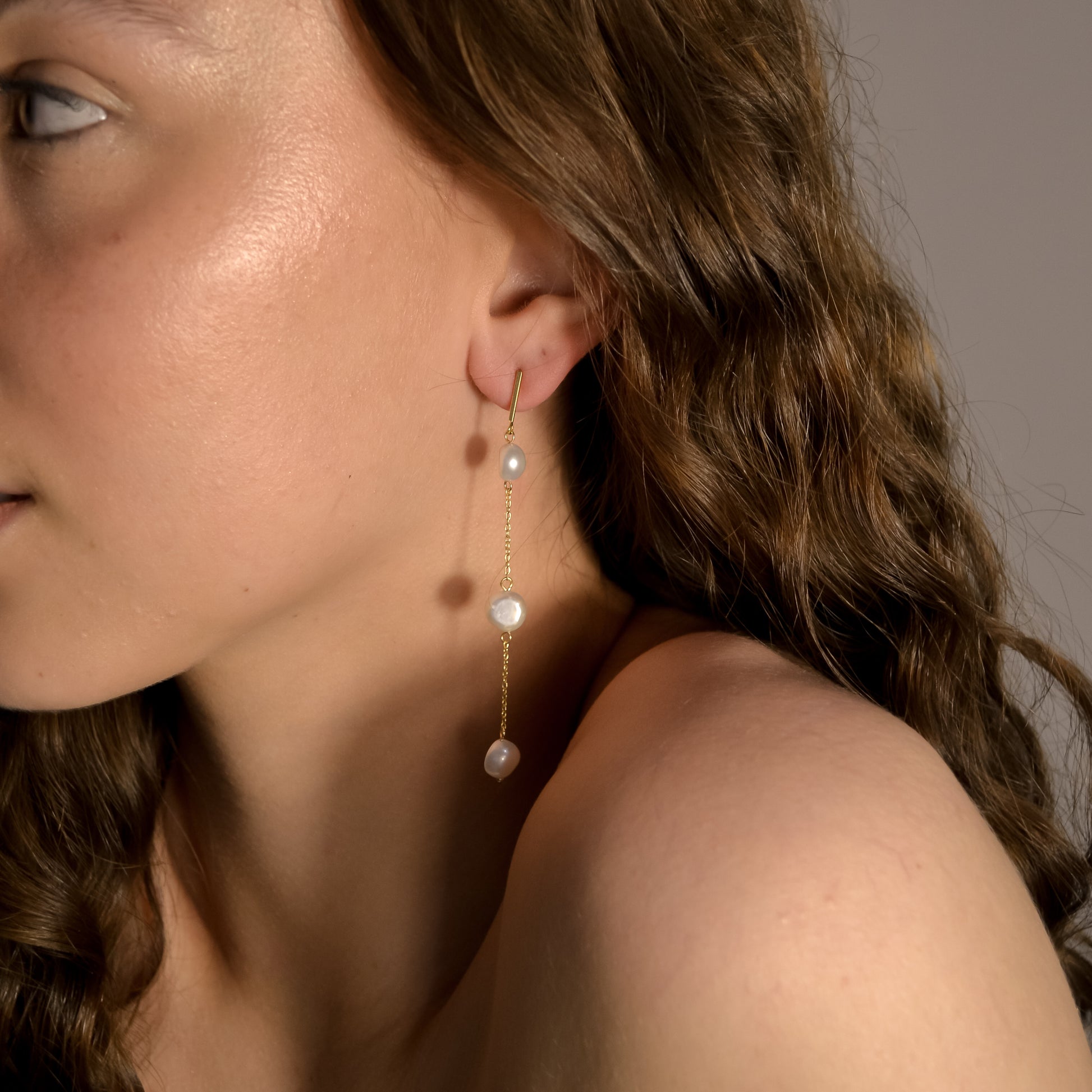 Model wearing Olivia collection, gold chain long drop, 3 pearls, handmade earrings