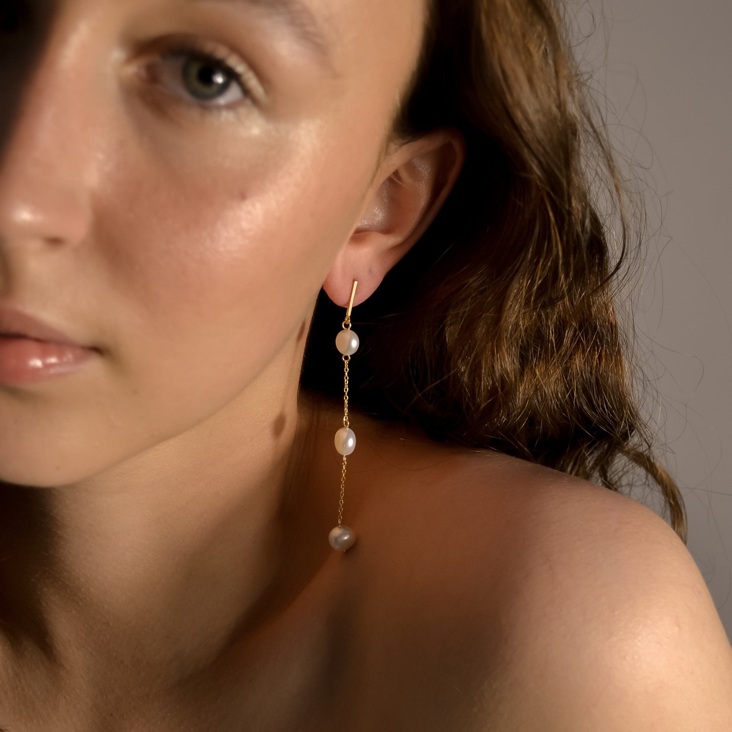 Model wearing Olivia collection, gold chain long drop, 3 pearls, handmade earrings