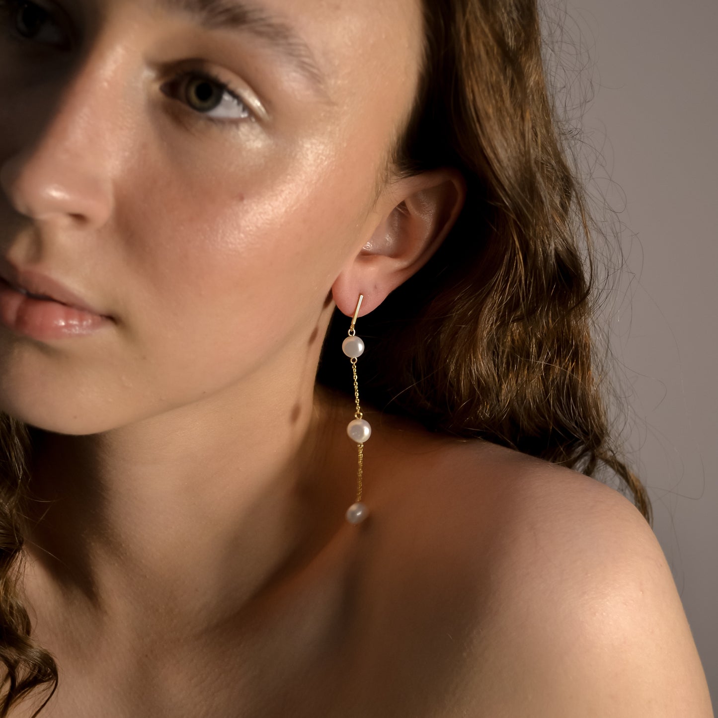 Model wearing Olivia collection, gold chain long drop, 3 pearls, handmade earrings