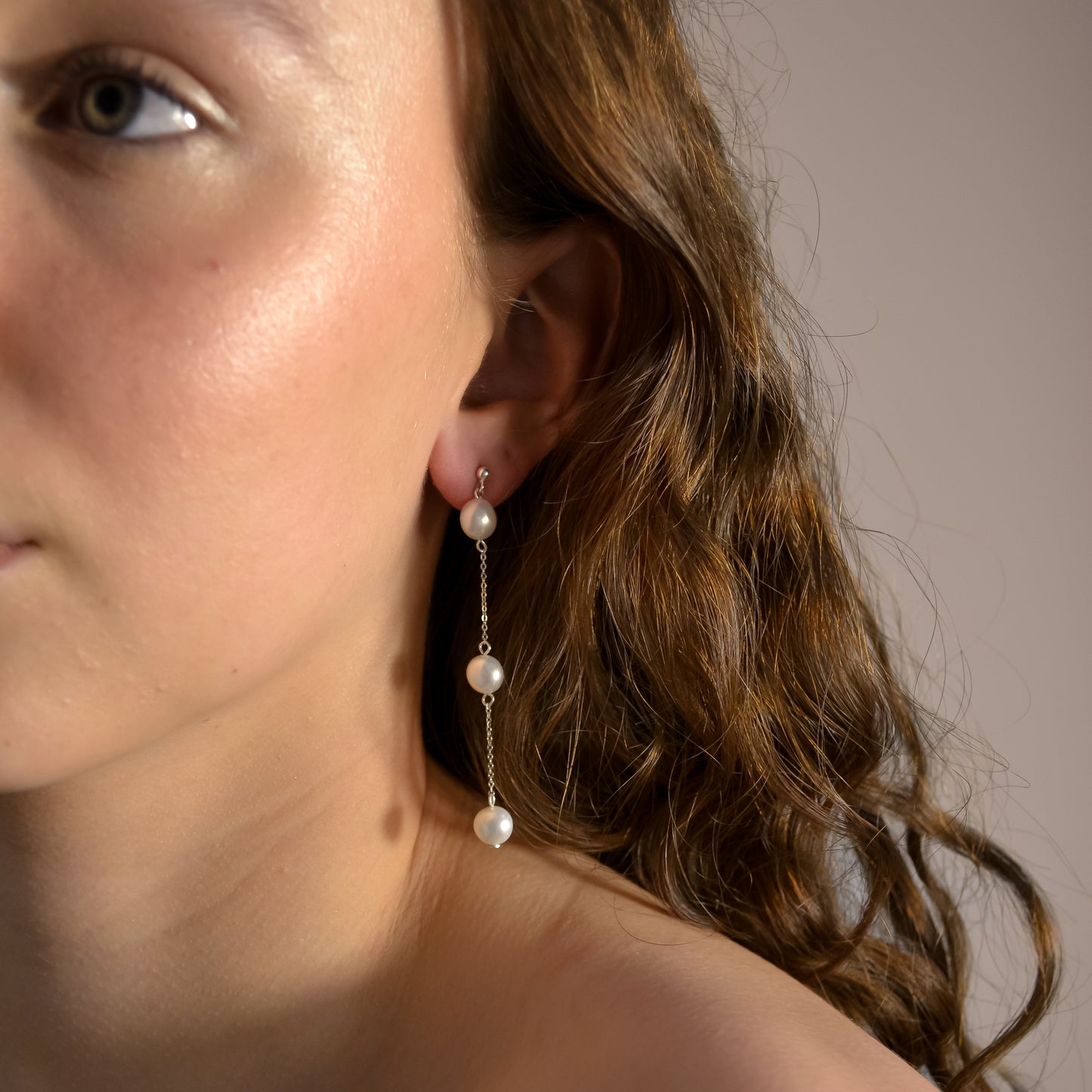 Model wearing Olivia collection, gold chain long drop, 3 pearls, handmade earrings