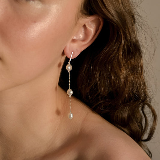 Model wearing Olivia collection, gold chain long drop, 3 pearls, handmade earrings