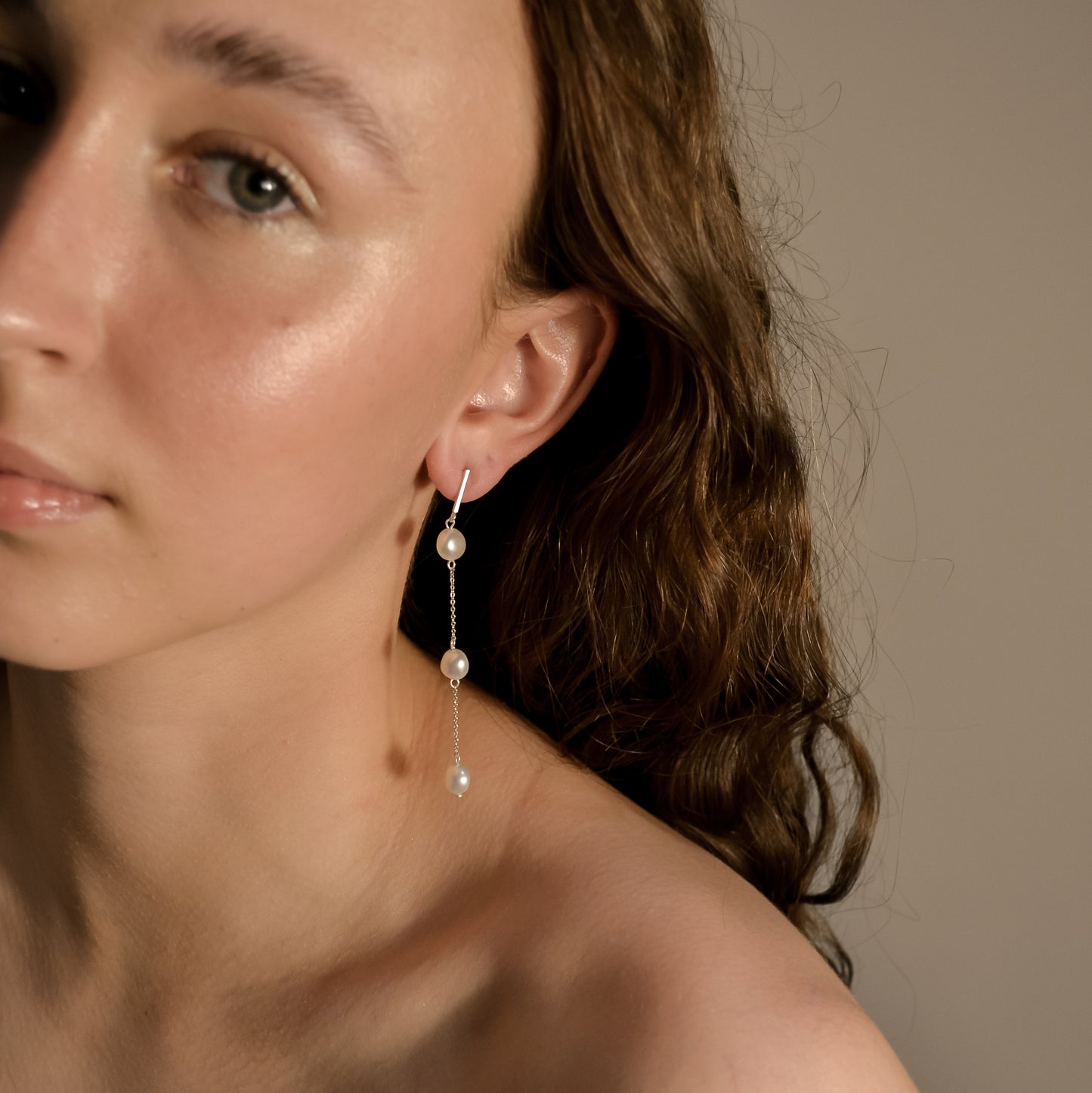 Model wearing Olivia collection, gold chain long drop, 3 pearls, handmade earrings