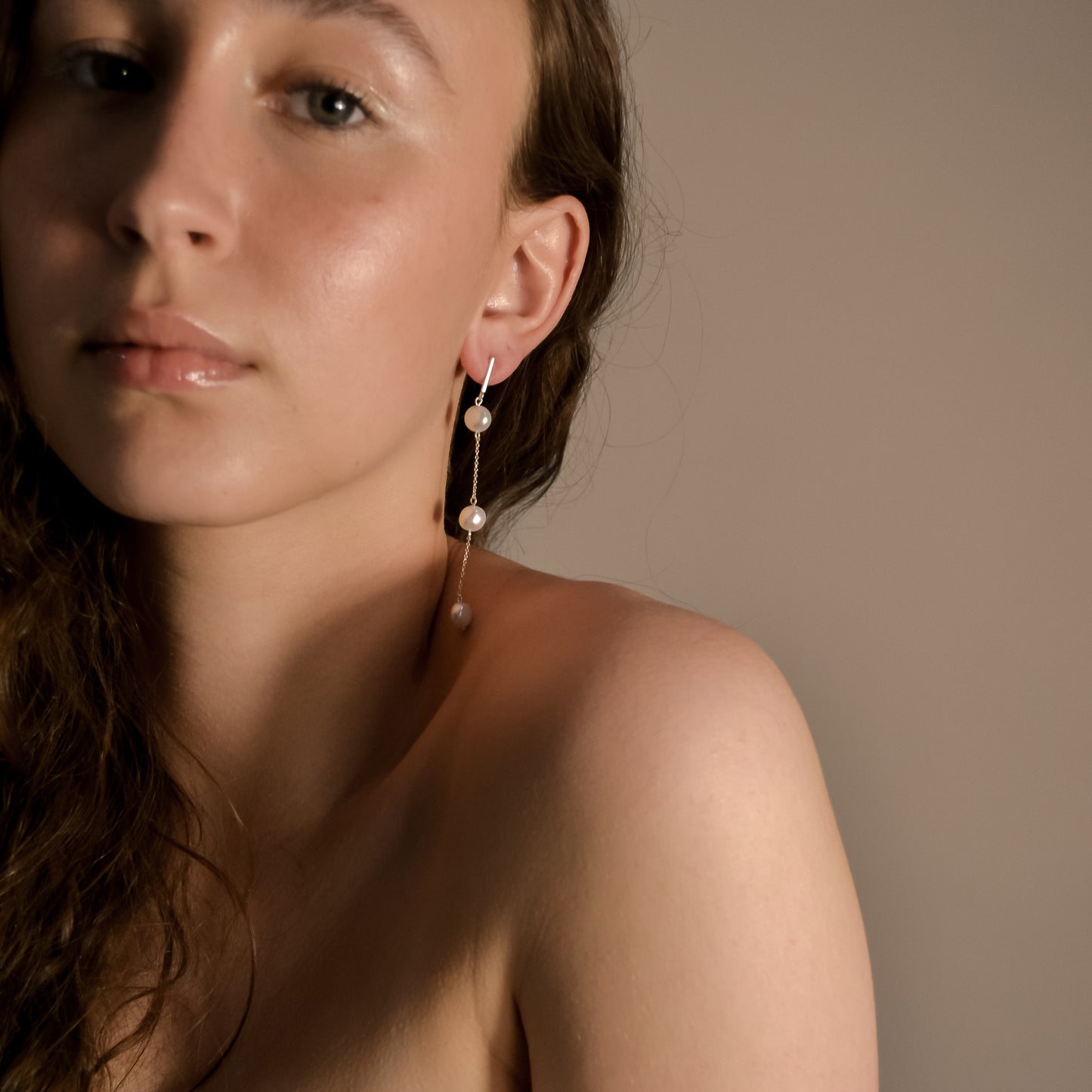 Model wearing Olivia collection, gold chain long drop, 3 pearls, handmade earrings