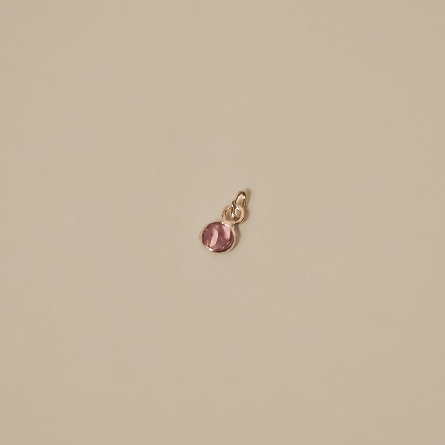 pink sapphire white gold round, tiny charm