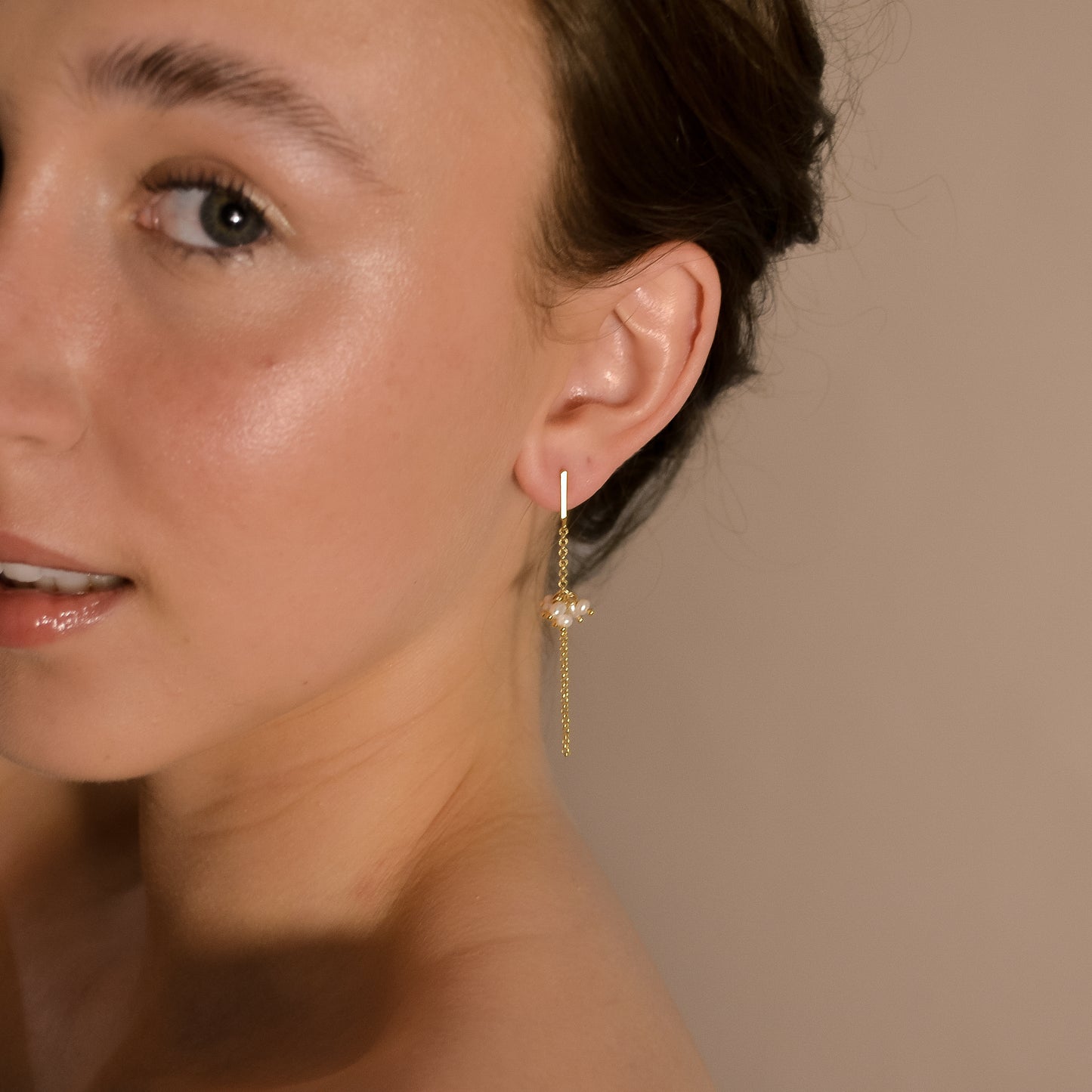 model wearing Willow collection, bridal, simple, elegant, gold chain, drop pearl cluster earrings.