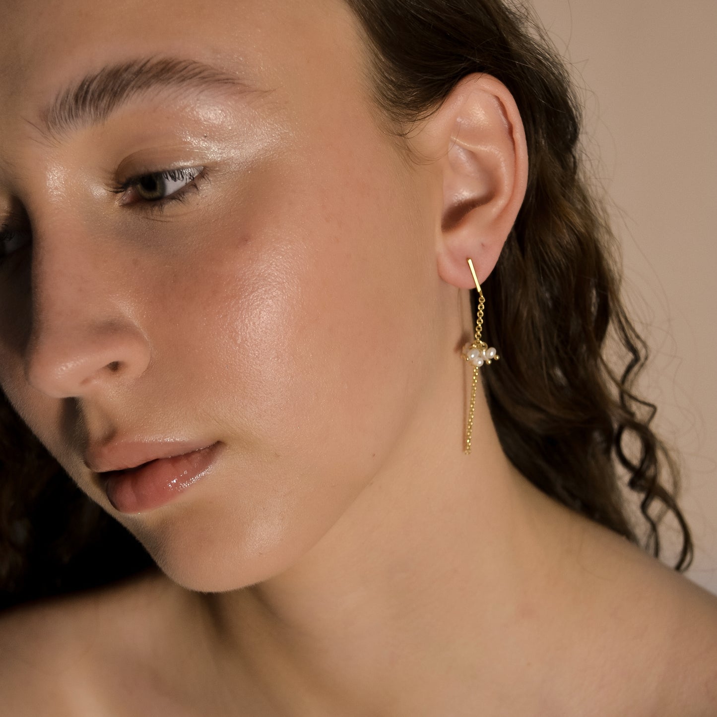 model wearing Willow collection, bridal, simple, elegant, gold chain, drop pearl cluster earrings.