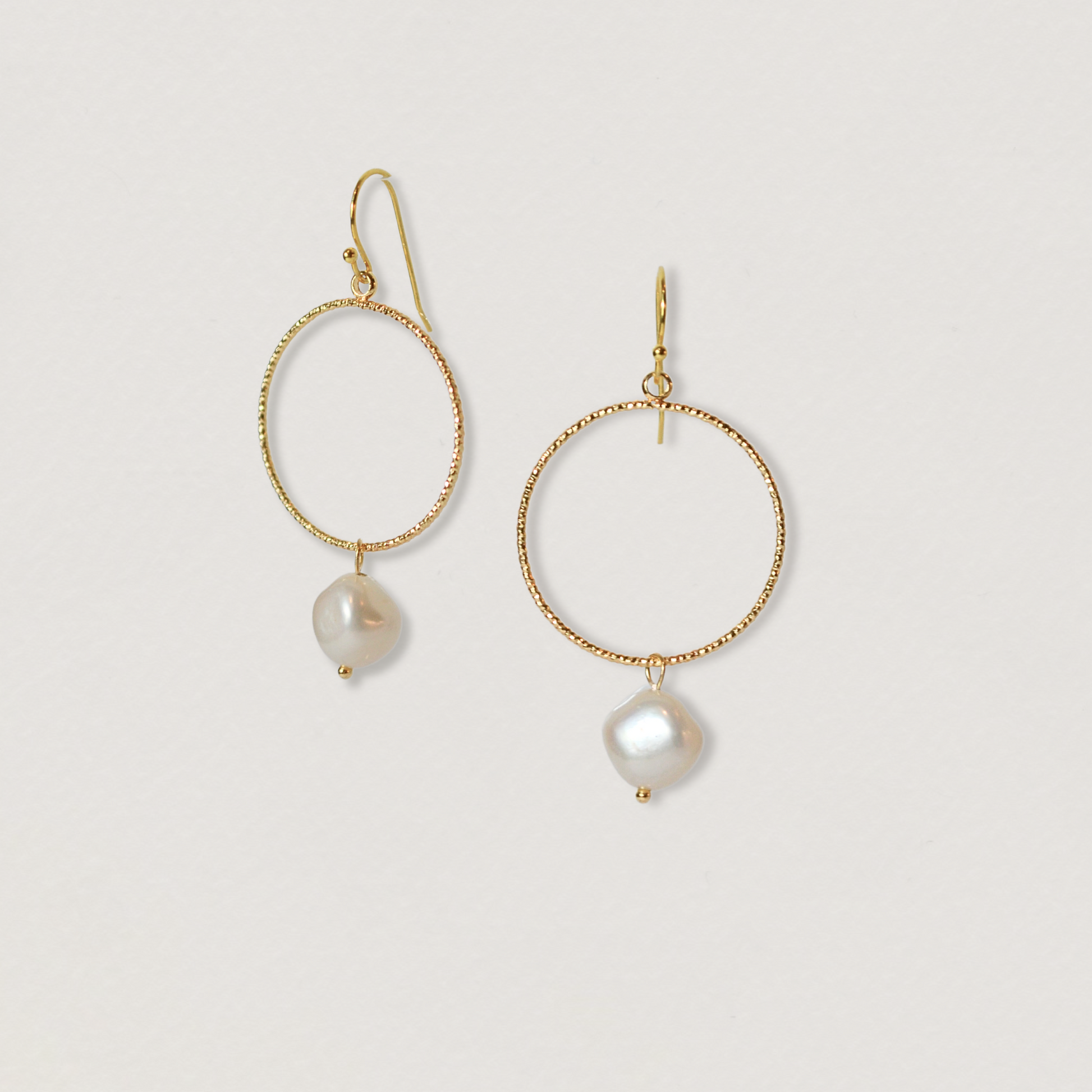 Gold pearl drop earrings with pearl