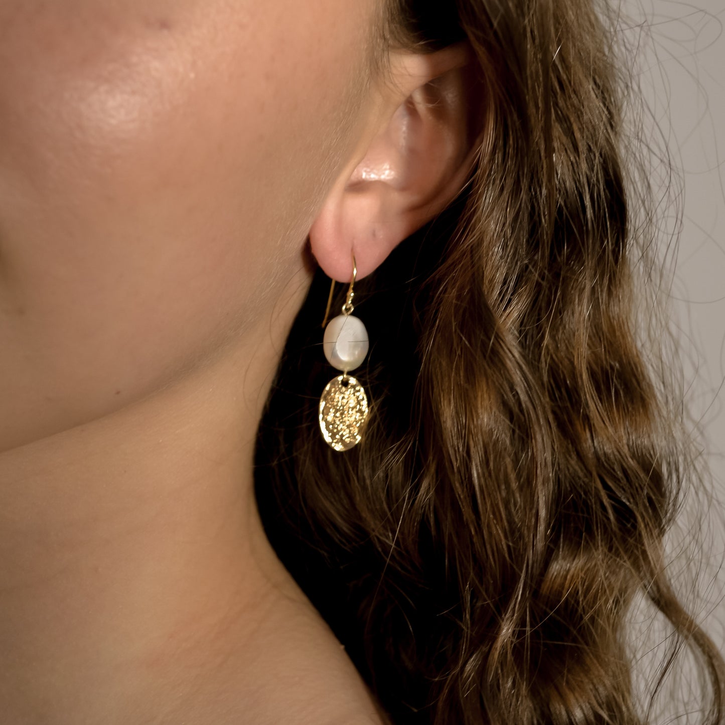 model wearing Alexis wedding pearl, gold, designer  earrings 