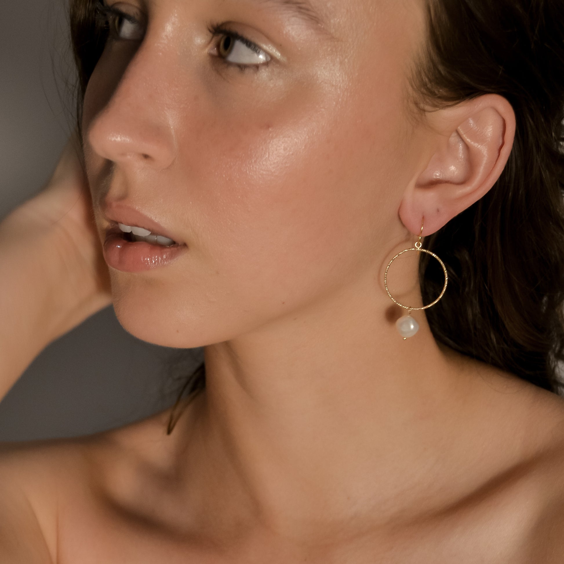 model wearing Avery range, gold stud with gold circle,  drop single pearl earrings 