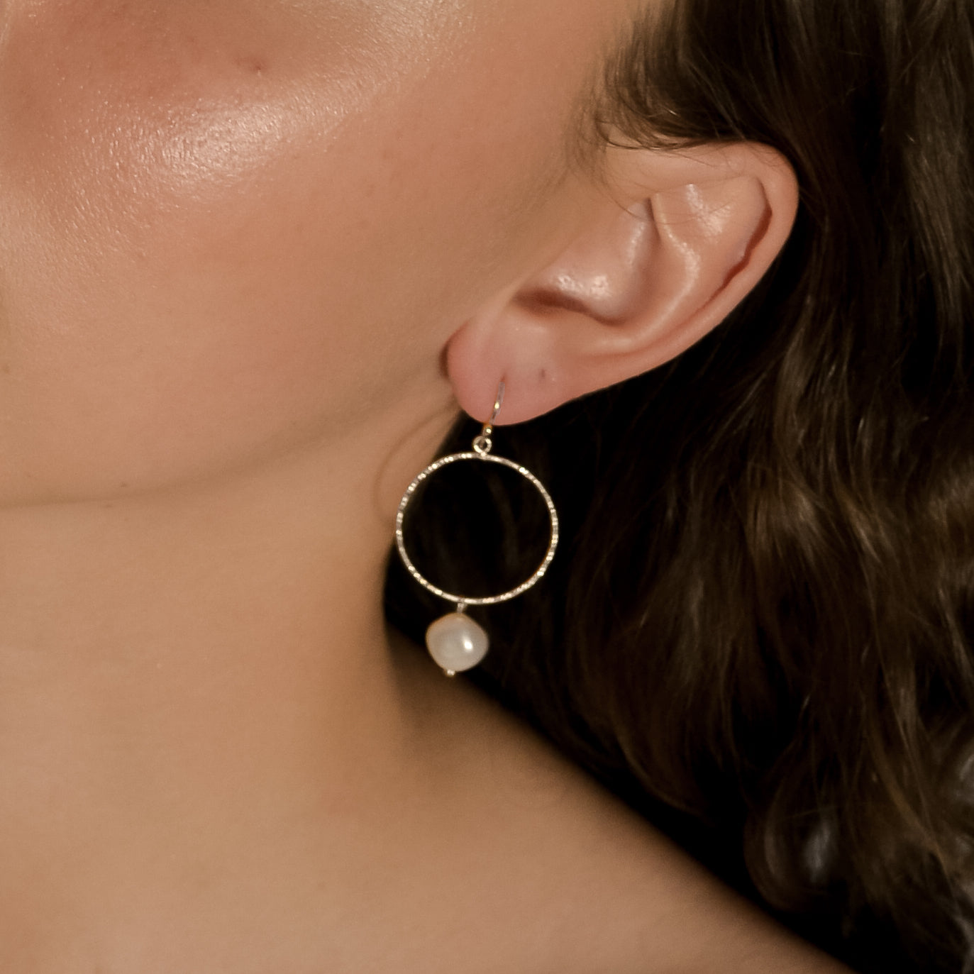 Avery silver pearl drop earrings on model 