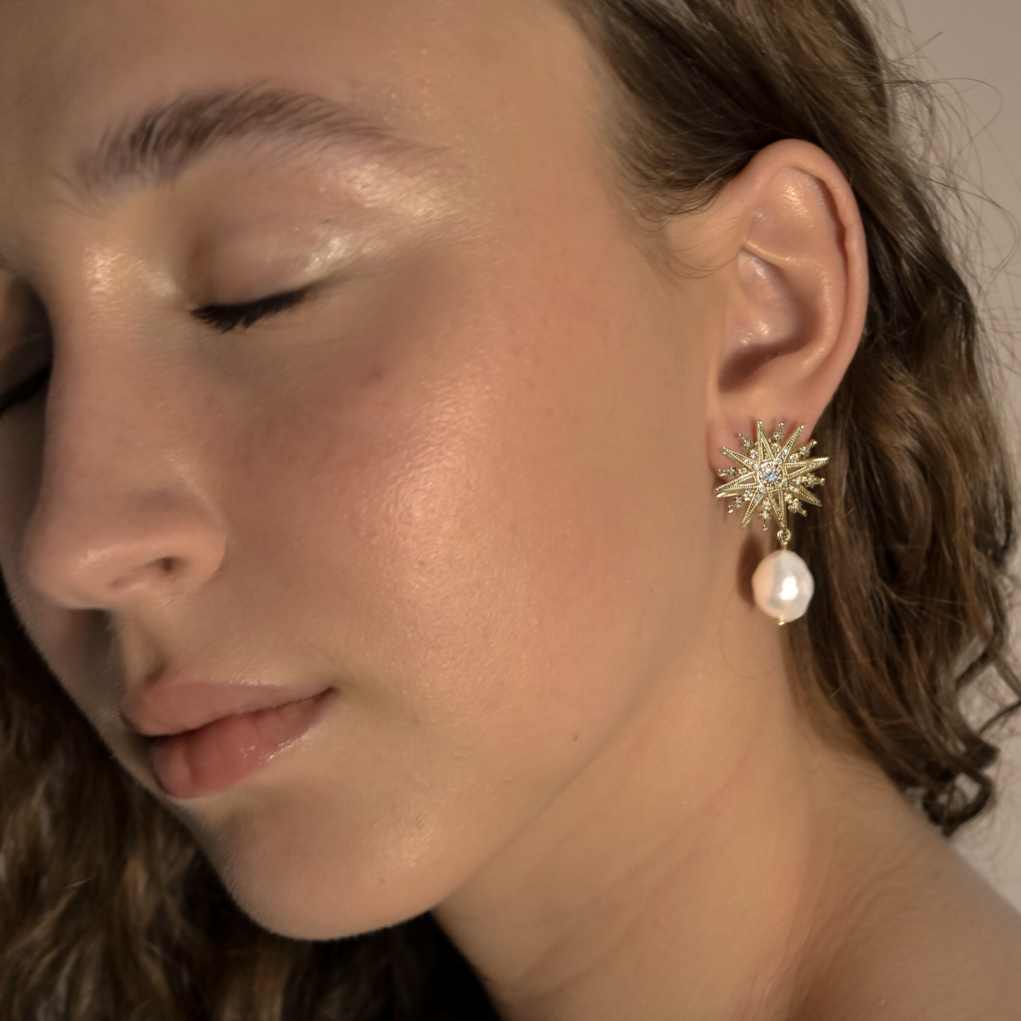 model wearing Clementine  range, gold bridal seed pearl unique, stud star,  earrings