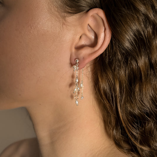 silver pearl drop earrings,    stylish silver pearl earrings on model, dulcie silver