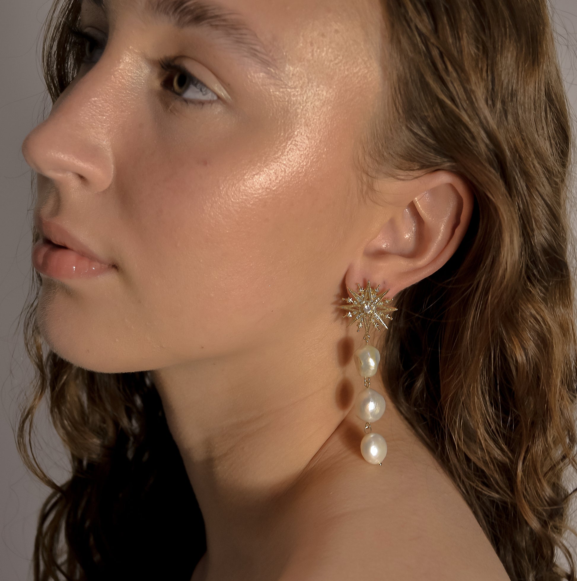 model wearing Ella collection, large triple pearl, with gold drop, stud earring, handmade designer 