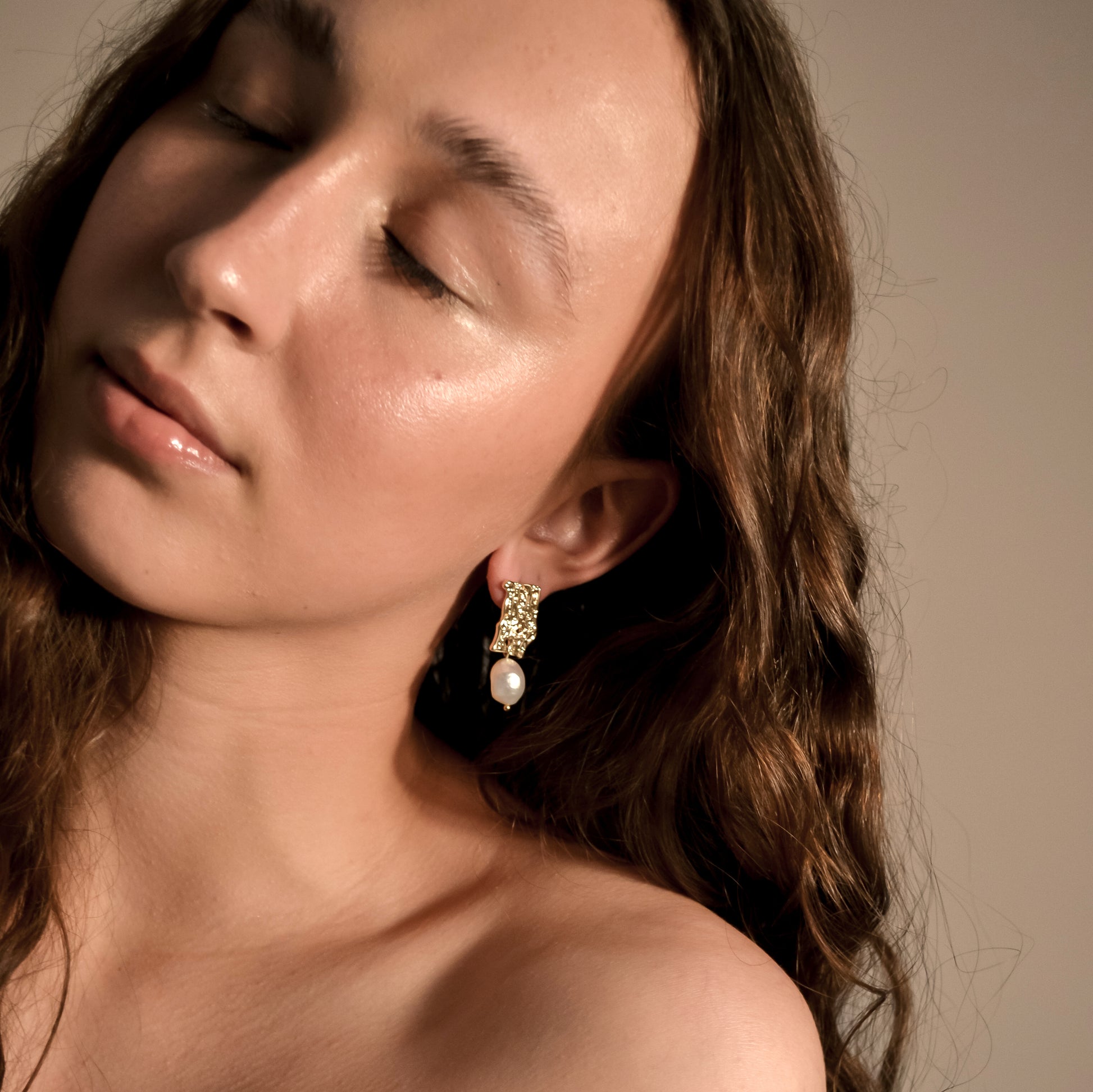 model wearing Genevieve collection, single large pearl, drop stud on gold pressed earring, unique stylish handmade s