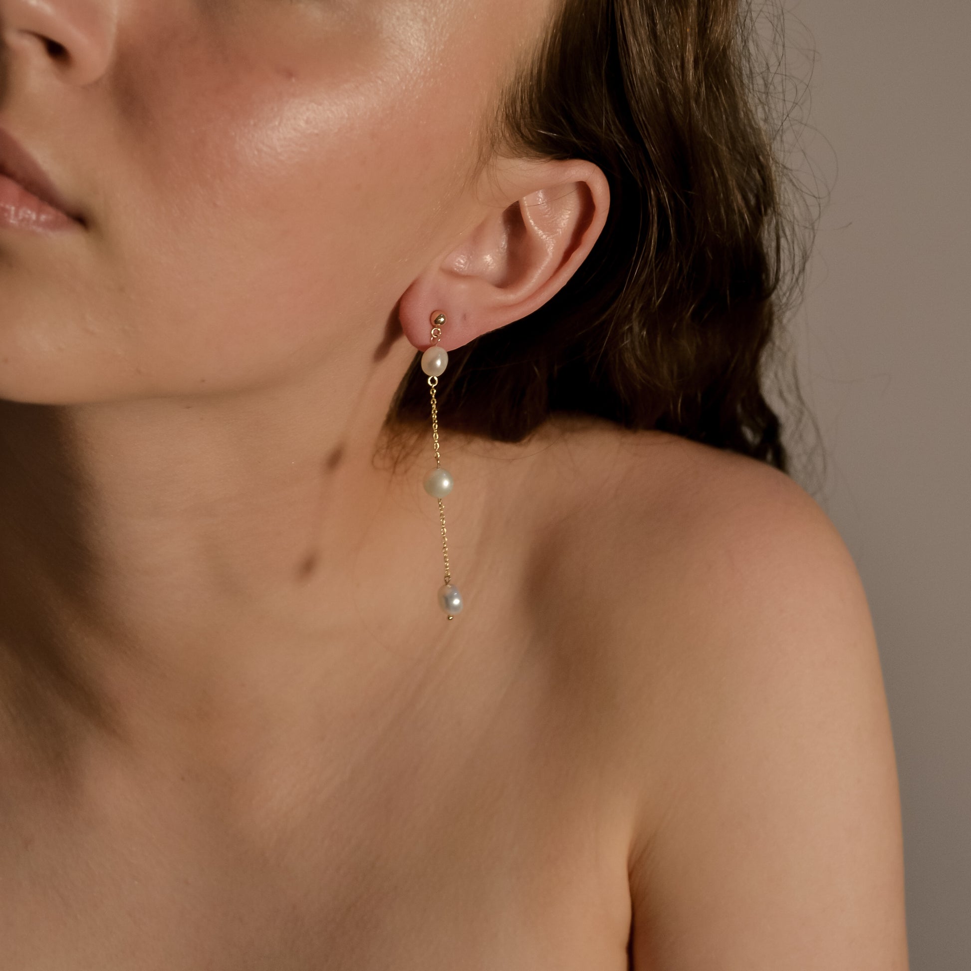Model wearing Olivia collection, gold chain long drop, 3 pearls, handmade earrings 