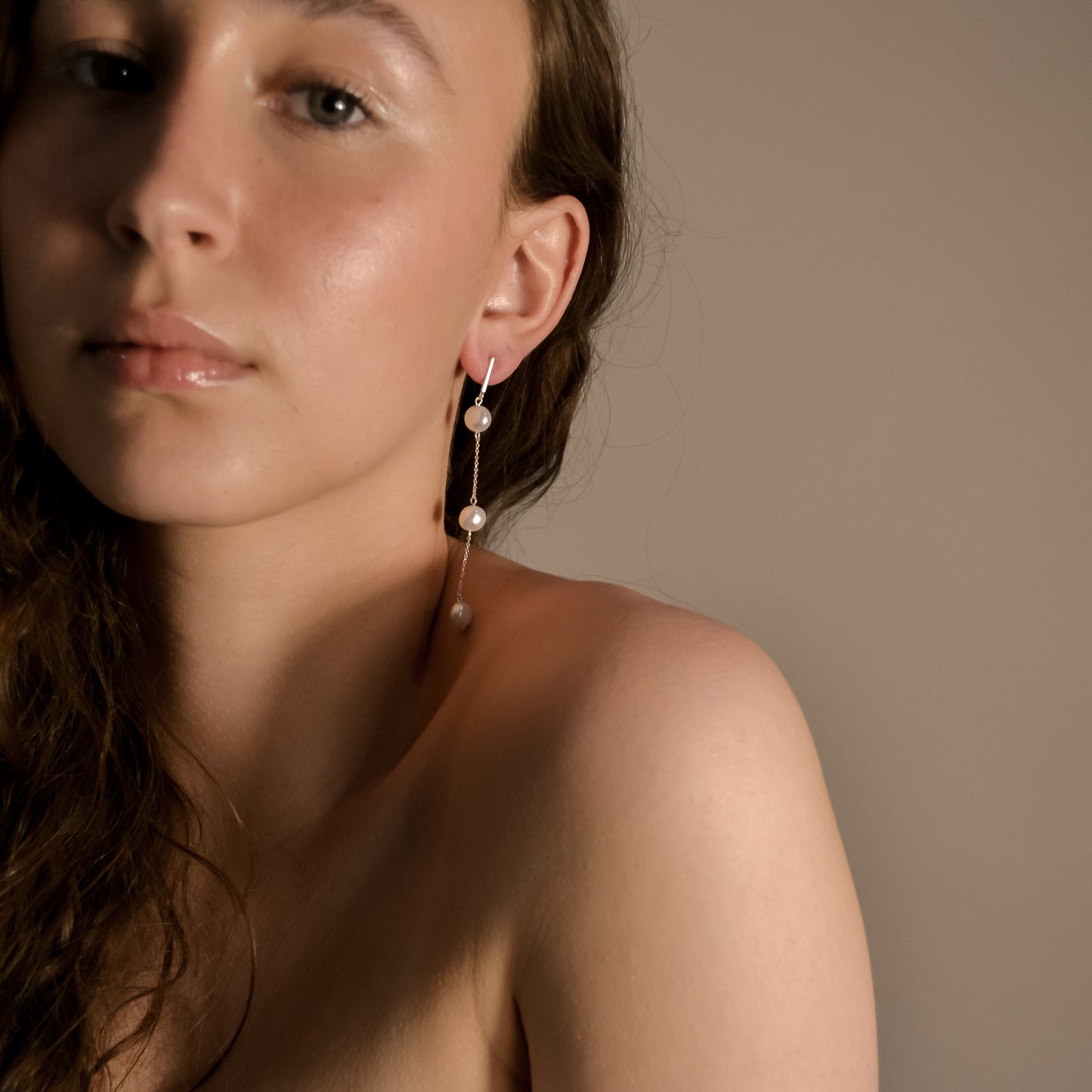Model wearing Olivia collection, gold chain long drop, 3 pearls, handmade earrings 