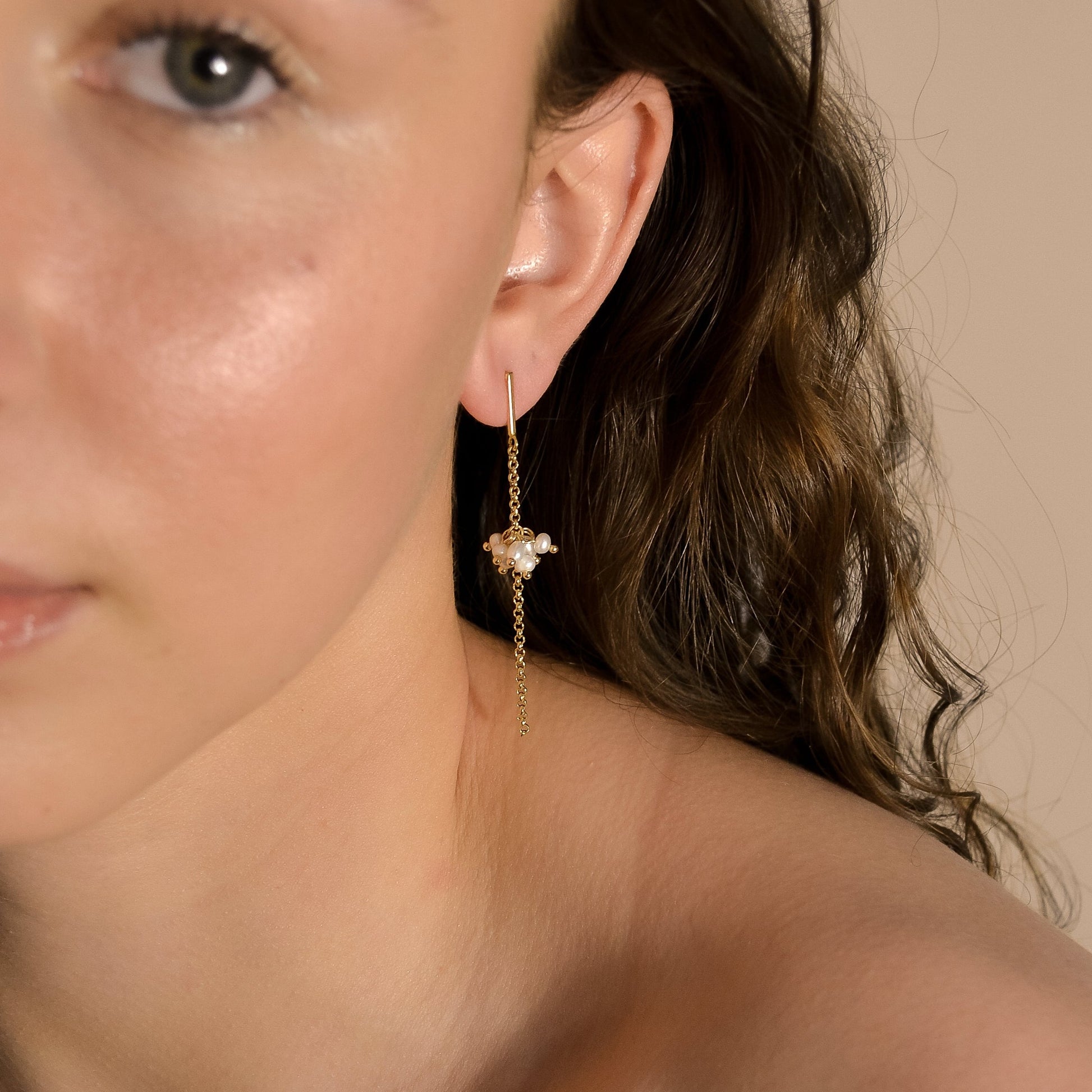 model wearing Willow collection, bridal, simple, elegant, gold chain, drop pearl cluster earrings. 